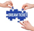 Hands with puzzle making DREAM TICKET word Royalty Free Stock Photo