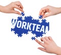 Hands with puzzle making WORKTEAM word