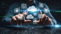 Person\'s hands interacting with holographic cloud computing and security icons in a digital network Royalty Free Stock Photo