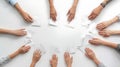 Hands Reaching for Paper on White Surface Royalty Free Stock Photo