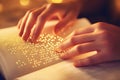 Hands Reading Braille Book in Warm Light Royalty Free Stock Photo
