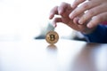 Hands ready to Grab a Real Bitcoin on table Royalty Free Stock Photo