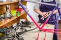 Hands of real bicycle mechanic cleaning frame bike