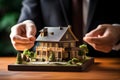 The hands of Real estate agents are delivering model homes from the housing project as gifts to customers. AI Generated