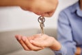 Hands, real estate and giving keys to customer after moving into new home. Property agent, realtor and handing over key Royalty Free Stock Photo