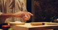 Hands, recipe and chef cooking sushi in restaurant for traditional Japanese cuisine or dish closeup. Kitchen Royalty Free Stock Photo