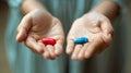 Hands with red and blue pill, making the right choice, knowledge or ignorance, decision between two paths Royalty Free Stock Photo