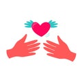 Hands release the winged heart. Hands holding a heart, give and share love to people concept. Royalty Free Stock Photo