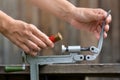 Hands reloading cartridge by shotgun shell reloader Royalty Free Stock Photo