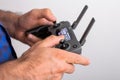 Hands with remote controller of drone outside. Man using RC for flying by drone Royalty Free Stock Photo