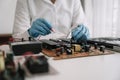 Hands repairing electronic devices. Electronic technician