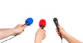 Hands of reporters with many microphones isolated on white