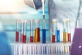 Hands of a researcher pipetting samples of fluids in tubes test Royalty Free Stock Photo