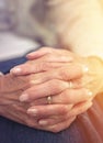 Hands, retirement and closeup with a mature woman indoor thinking about a past memory of nostalgia. Fingers, wrinkles Royalty Free Stock Photo