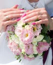 Hands and wedding bouquet