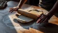 Hands Rolling Dough on a Floured Wooden Table, Baking Preparation Royalty Free Stock Photo