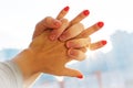 Hands of Romantic Couple Holding Together with Sun Rays Royalty Free Stock Photo