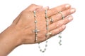 Hands and rosary beads