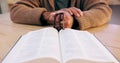 Hands, rosary and bible with closeup for faith, peace and hope at desk, home or praying for worship. Person, cross and Royalty Free Stock Photo