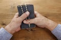 Hands with rosary over old Holy Bible Royalty Free Stock Photo