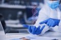 Hands, scientist and dna hologram in lab analysis, studying and gloves for safety, health and medical research. Virus Royalty Free Stock Photo