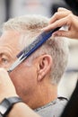 Hands, scissors and comb with man in salon for haircut by hairdresser, barber and hair care service. Barbershop Royalty Free Stock Photo