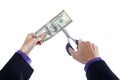 Hands with scissors cutting money Royalty Free Stock Photo