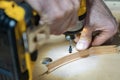 hands screwing wood in the workshop