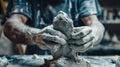 Hands of a sculptor sculpting a clay figure