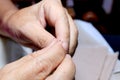 Hands of seamstress at work on the wooden chair with her cloth , hand made soft toys sewing with felt and needle Royalty Free Stock Photo