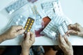 Hands of senior female patients holding medicine pill and capsules,asian old people with chronic illness is carrying medication to Royalty Free Stock Photo