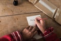 Hands of a senior man doing calligraphy Royalty Free Stock Photo