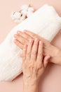 Hands of a senior woman with nude manicure Royalty Free Stock Photo