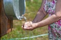 Hands of senior woman when washing hands outdoor Royalty Free Stock Photo