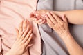 Hands of a senior and young women with nude manicure Royalty Free Stock Photo