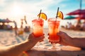 Hands of seniors with beach cocktails by the sea. Retirement