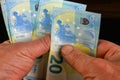 Hands several cash twenty euro bills, recalculation banknotes. Parsimony, savings, home finance