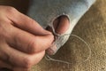 Hands sew up the hole in the sock Royalty Free Stock Photo