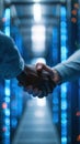 Hands Shaking in Data Center with Servers and Blue LED Lights in Background Royalty Free Stock Photo