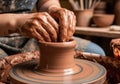 Hands Shaping Clay on a Pottery Wheel in a Studio Royalty Free Stock Photo