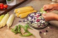 Hands shelling fresh colorful beans