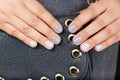 Hands with short manicured nails colored with gray nail polish Royalty Free Stock Photo
