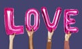 Hands showing love balloons word Royalty Free Stock Photo