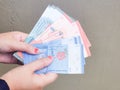 Hands showing Malaysia bank notes. Royalty Free Stock Photo