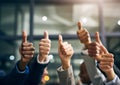 Hands showing thumbs up with business men endorsing, giving approval or saying thank you as a team in the office Royalty Free Stock Photo