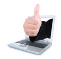 Hands showing thumbs up out of the laptop screen Royalty Free Stock Photo