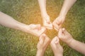 Hands showing thumbs up over green natural background Royalty Free Stock Photo