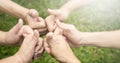 Hands showing thumbs up over green natural Royalty Free Stock Photo