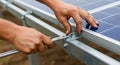 Installing Solar Panel System with Wrench Tightening a Bolt Royalty Free Stock Photo