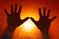 Hands Silhouette on Fire Orange Color Background